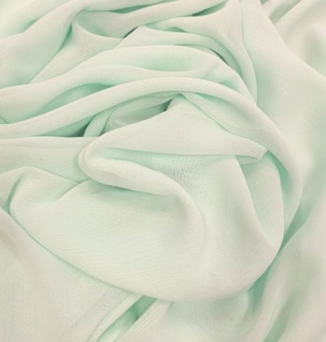 Világos türkiz színű muszlin anyag.

Szélessége: 140 cm

Anyagösszetétel: 100 % poliészter